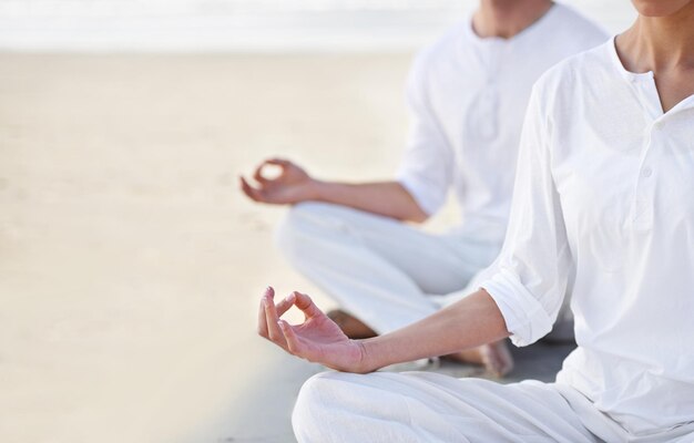 Photo lotus pose couple and meditation on beach for zen and wellness with holistic healing outdoor for calm and yoga ocean people and mindfulness together for bonding peace and spiritual in nature