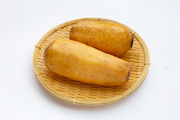 Lotus roots in bamboo plate on white background