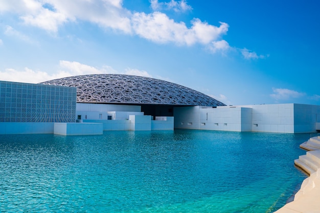 Louvre, Abu Dhabi, United Arab Emirates - May 10, 2020.  The famous Louvre museum of the French architect Jean Nouvel - panoramic view from the tribune.