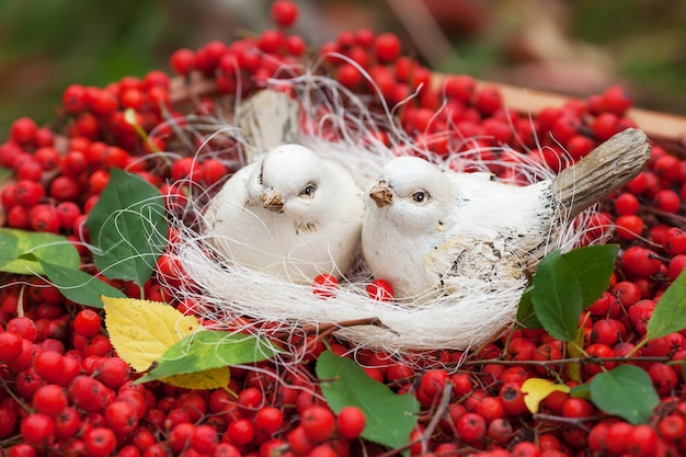 Love ceramics white birds and mountain ash berries. Vintage shabby chic style. Soft warm tender feelings. 