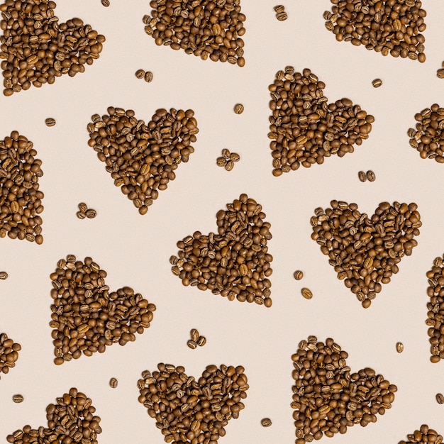 Love coffee concept hearts from coffee beans on beige color background roasted brown coffee