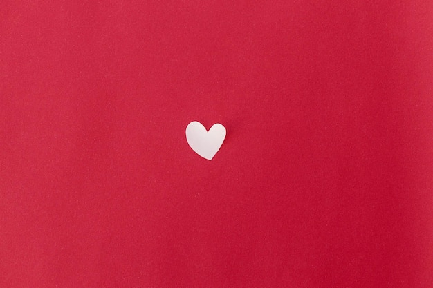 Love concept Valentine heart flat lay on red background with space for text Happy Valentine's Day