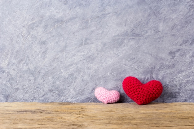 Love concepts of two heart on wood table