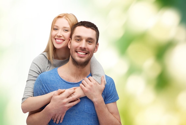 love and family concept - smiling couple hugging