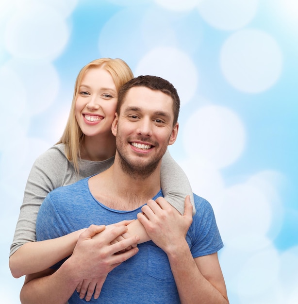 love and family concept - smiling couple hugging