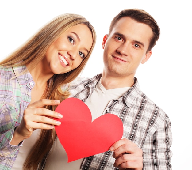 Love, family and people concept: Happy couple in love holding red heart