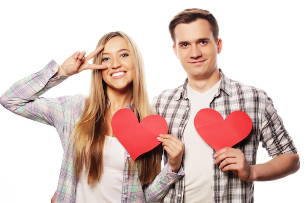 Love, family and people concept: Happy couple in love holding red heart