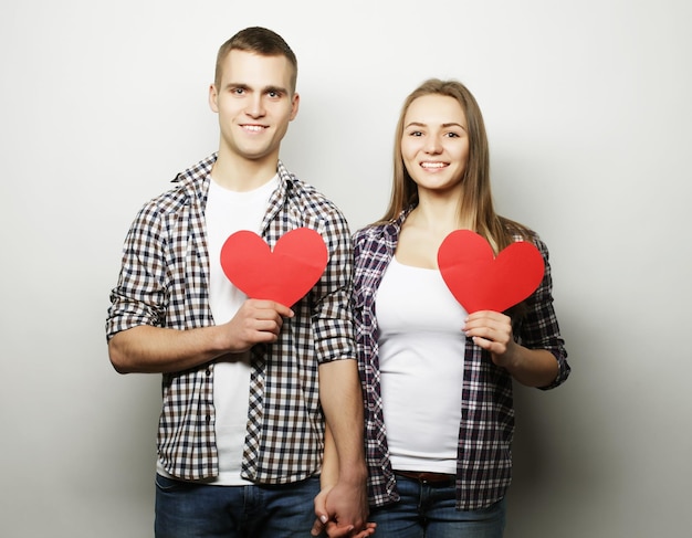 Love family and people concept Happy couple in love holding red heart