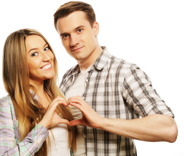 Love, family and people concept: happy couple in love showing heart with their fingers