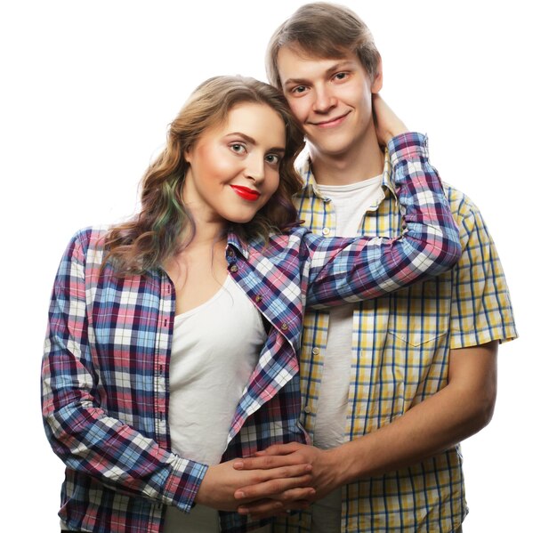 Love, family and people concept: lovely happy couple hugging over white background.