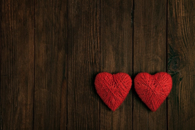 Love hearts on wooden texture background