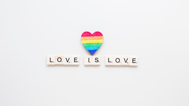 Love is love inscription with rainbow heart