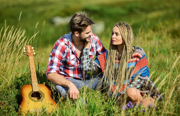 Love language country music romantic date friendship campfire songs men play guitar for girl happy friends with guitar couple in love spend free time together western camping hiking