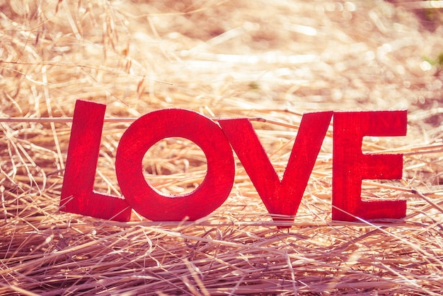 Photo love letters on a yellow template with sun light on background