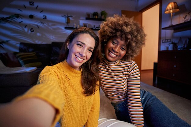 In love lgbt multiracial young lesbian couple take selfie smiling to camera people relationship