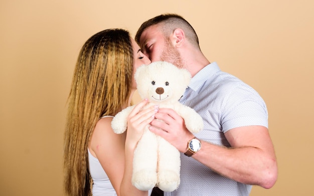 Love in look romantic relationship love date family values couple in love family relations and happiness valentines day present sexy girl and man hold teddy bear man and woman embrace