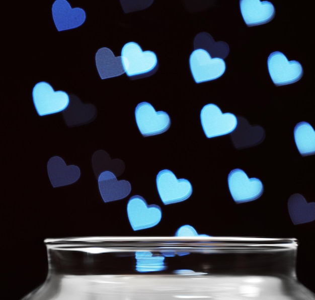 Love magic bottle on black background