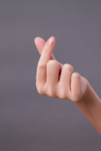 Photo love, peace, heart hand gesture studio isolated