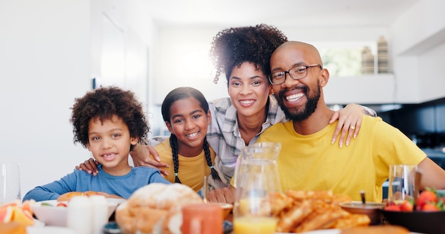love portrait and happy family with breakfast at a kitchen table for morning routine or eating while bonding food nutrition or kids with parents in a house with fruit diet or brunch meal at home