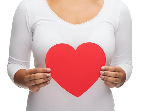 love and relationships concept - closeup of woman hands with heart