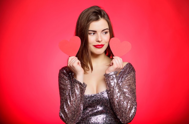 Love and romance. Valentines day sales. Sexy woman in glamour dress. Sensual girl with heart. Valentines day party. I love you. Romantic greeting. Be my valentine. Getting away from everything.