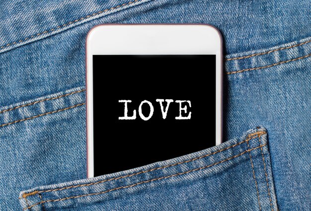 Love on space phone on jeans love and valentine concept