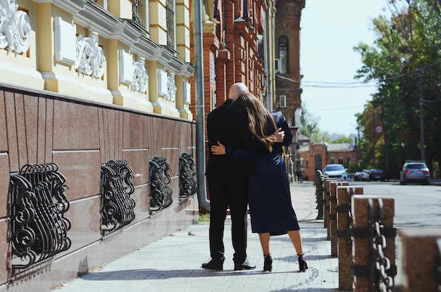 Love story of cute couple. young man. Woman in white wedding skirt. Love. Happy family. Autumn city