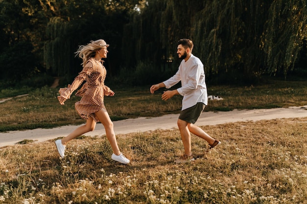 Love story in park Man and woman run to each other for meeting after long separation