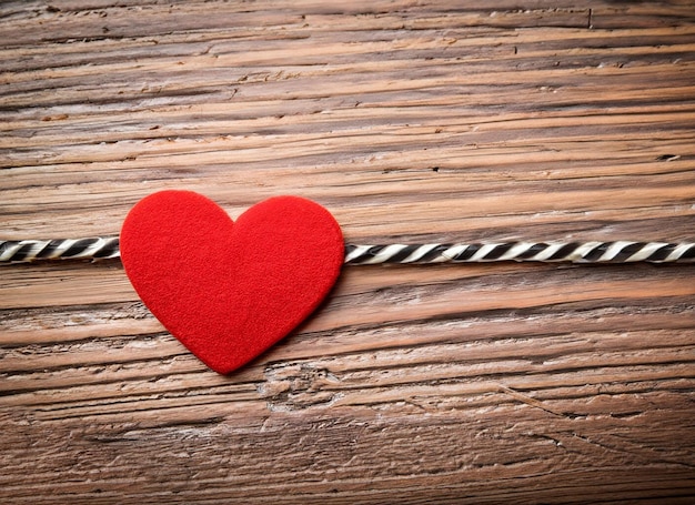 Love symbol on old wooden wall