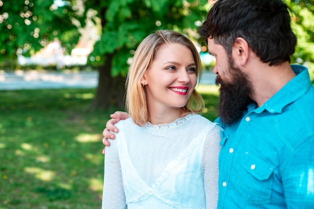 Love and tenderness. Couple looks each other outdoor.