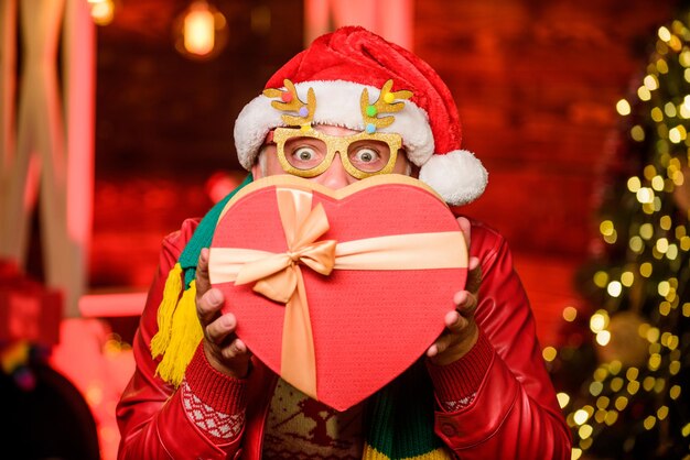 Love time. winter holiday shopping. party celebration. bearded man go shopping. xmas gifts. happy new year. Secret santa. gifts at Christmas tree. Merry christmas. presents from santa.