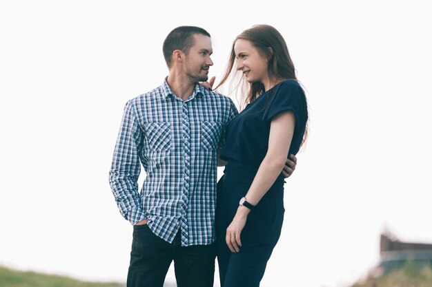 In love with a young couple standing on the street