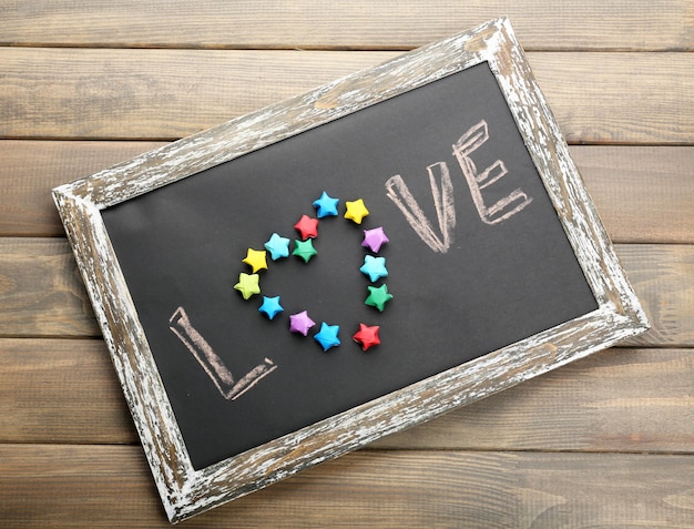Love written on chalkboard, close-up