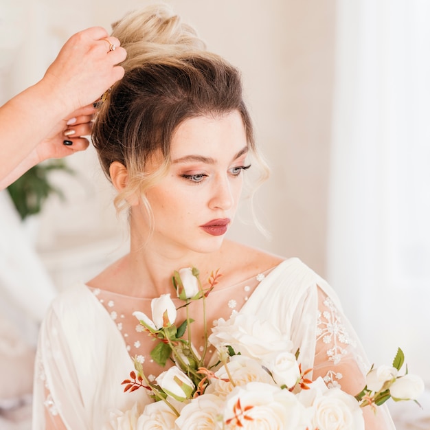 Lovely bride getting her hair done