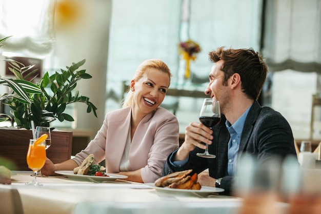 Lovely couple celebrating anniversary at hotel restaurant