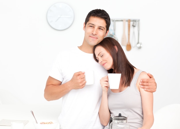 Photo lovely couple drinking coffee during breakfast
