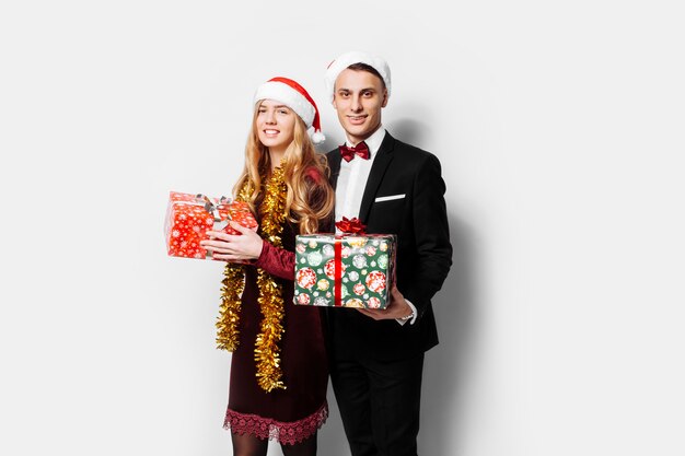 Lovely couple giving Christmas gifts