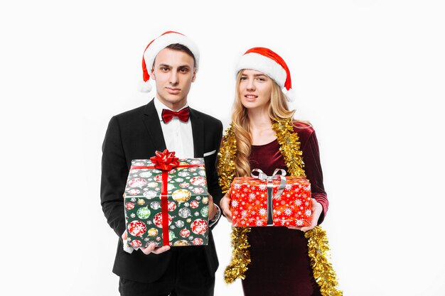 Lovely couple giving Christmas gifts