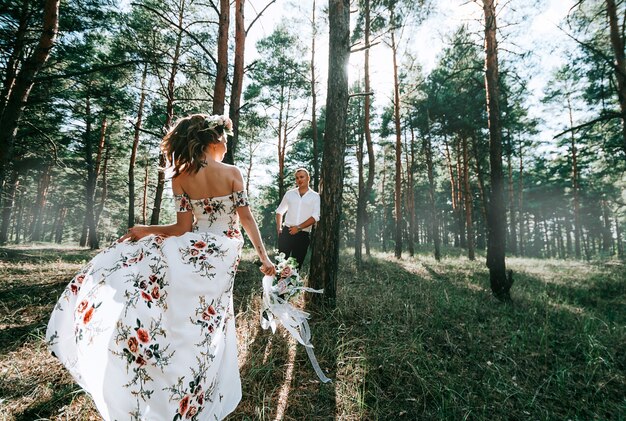 Lovely couple in a green forest