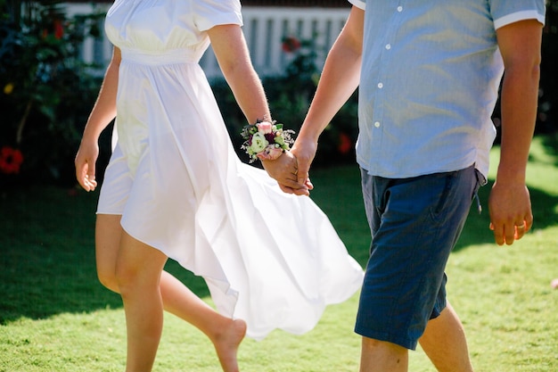 Lovely couple holding hands together. Close up shot