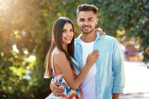 Lovely couple hugging on street