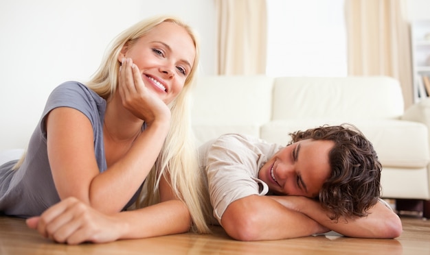 Lovely couple lying on the floor