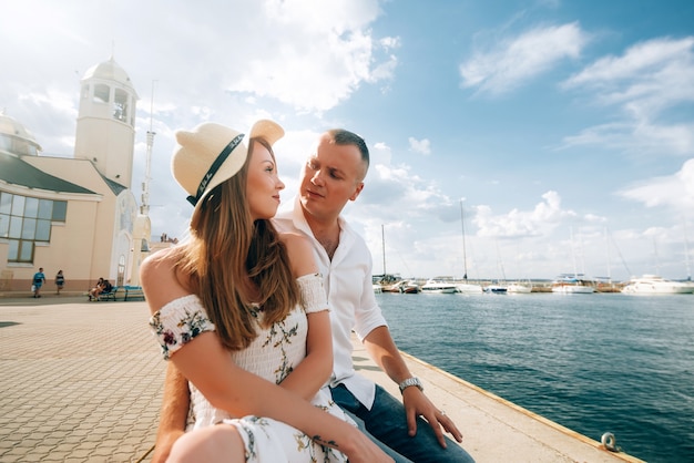 Lovely couple in a pier in summer