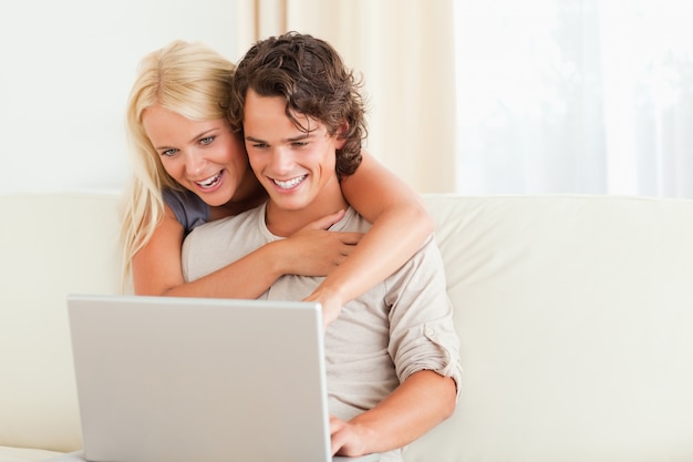 Lovely couple using a notebook