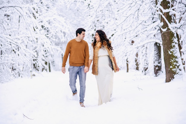 lovely couple walking in the snow