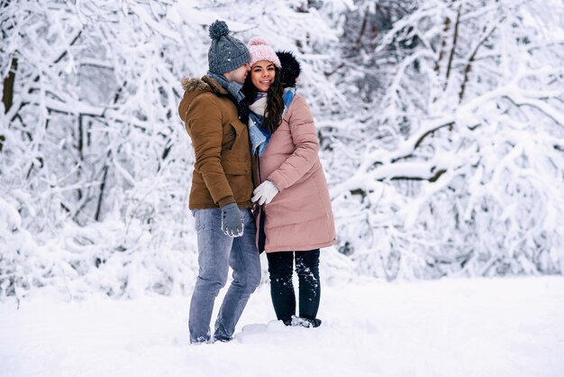 lovely couple walking in the snow