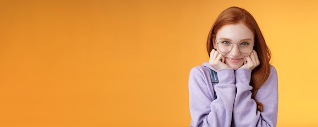 Lovely cute redhead sweet silly girl geek university student wearing glasses lean hand smiling tende