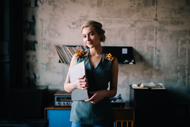 Lovely elegant woman in music room.