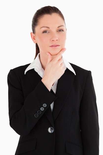 Lovely female in suit posing while standing