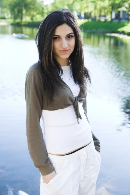 Lovely girl beside a lake